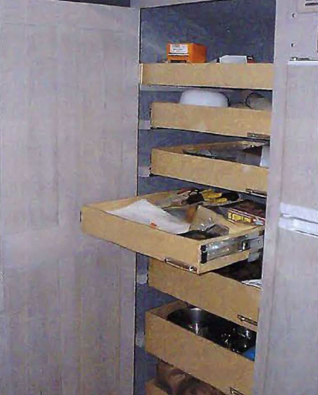 A shot of segments on the right side of the coach. These would be designated for the house refrigerator, pantry vanily, wardrobe and the completed bedroom in the back.