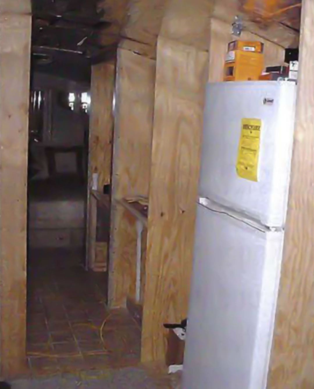 The carpeted pantry with pull-out drawers installed
