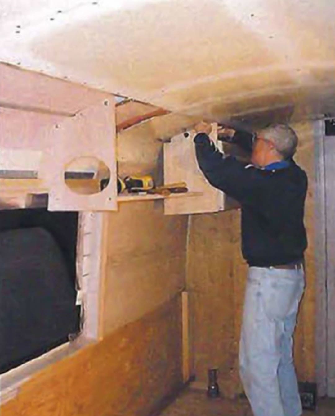 The beginning of the kitchen overhead cabinets. Note the cutout for the stereo speaker.