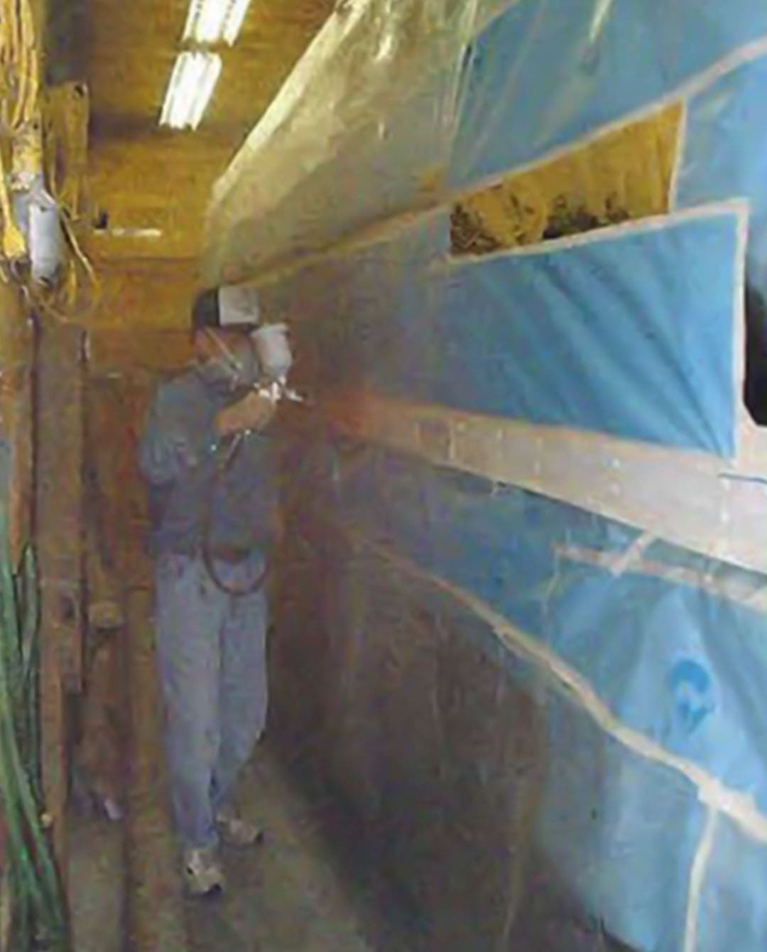 Roger painting the graphics in the Titus' garage.