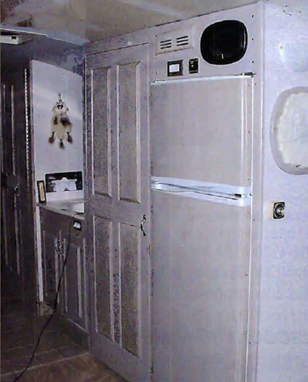 The completed refrigerator pantry and vanity. The Titu's laminated the refrigerator with oak vaneer and stained it to match the cabinets.