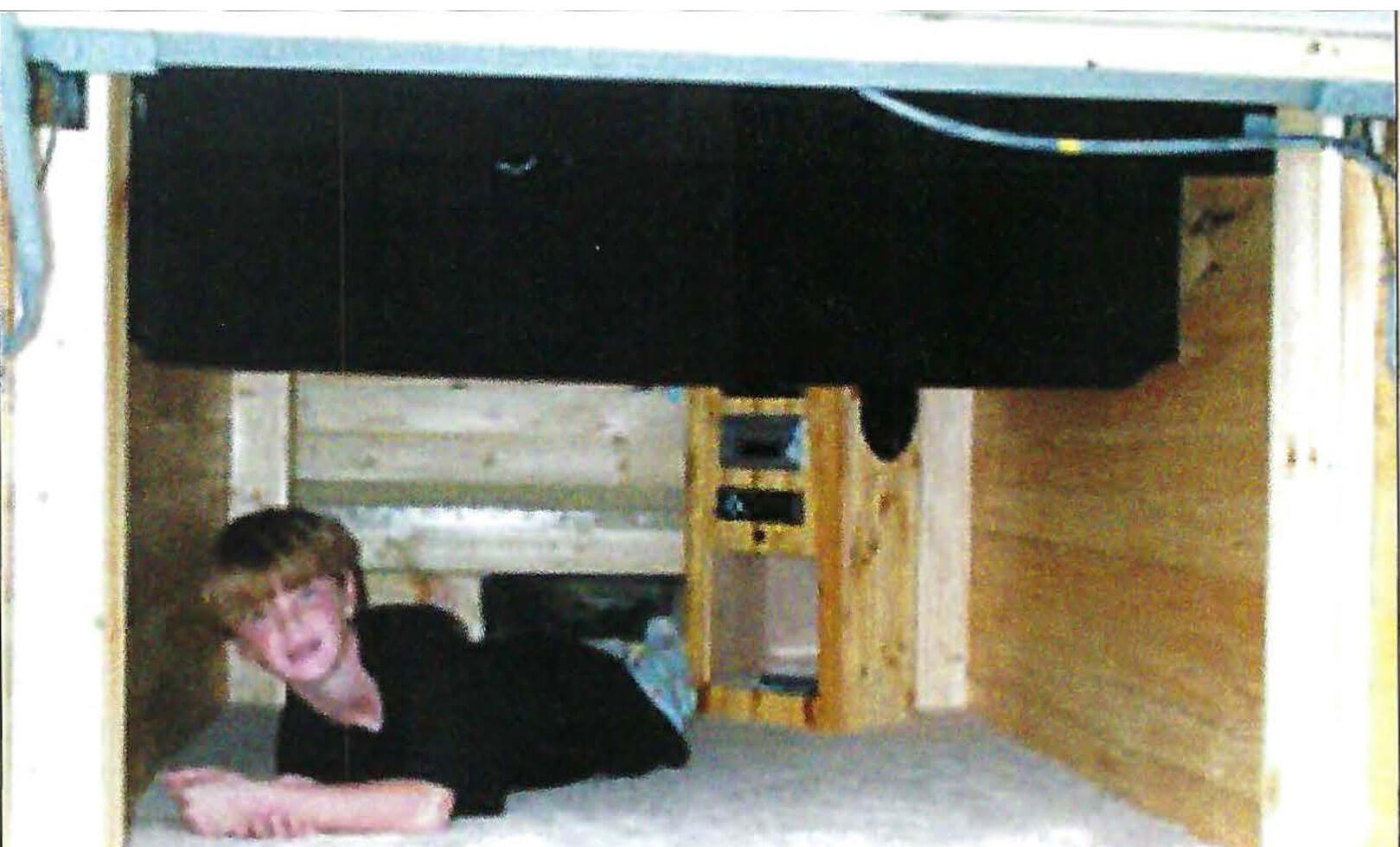 An Underbay Sleeping Compartment in a Bus Conversion - bus conversion photo