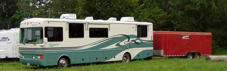 1976 Fleetwood Discovery with 20’ Car Hauler Trailer containing my Harley and my 4-Runner.