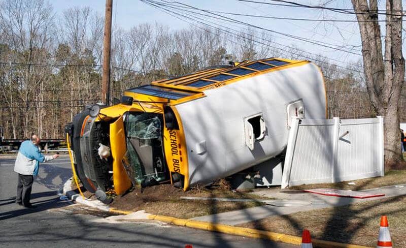 School bus involved in a roll over crash. Notice the roof hatch was used to exit the vehicle.