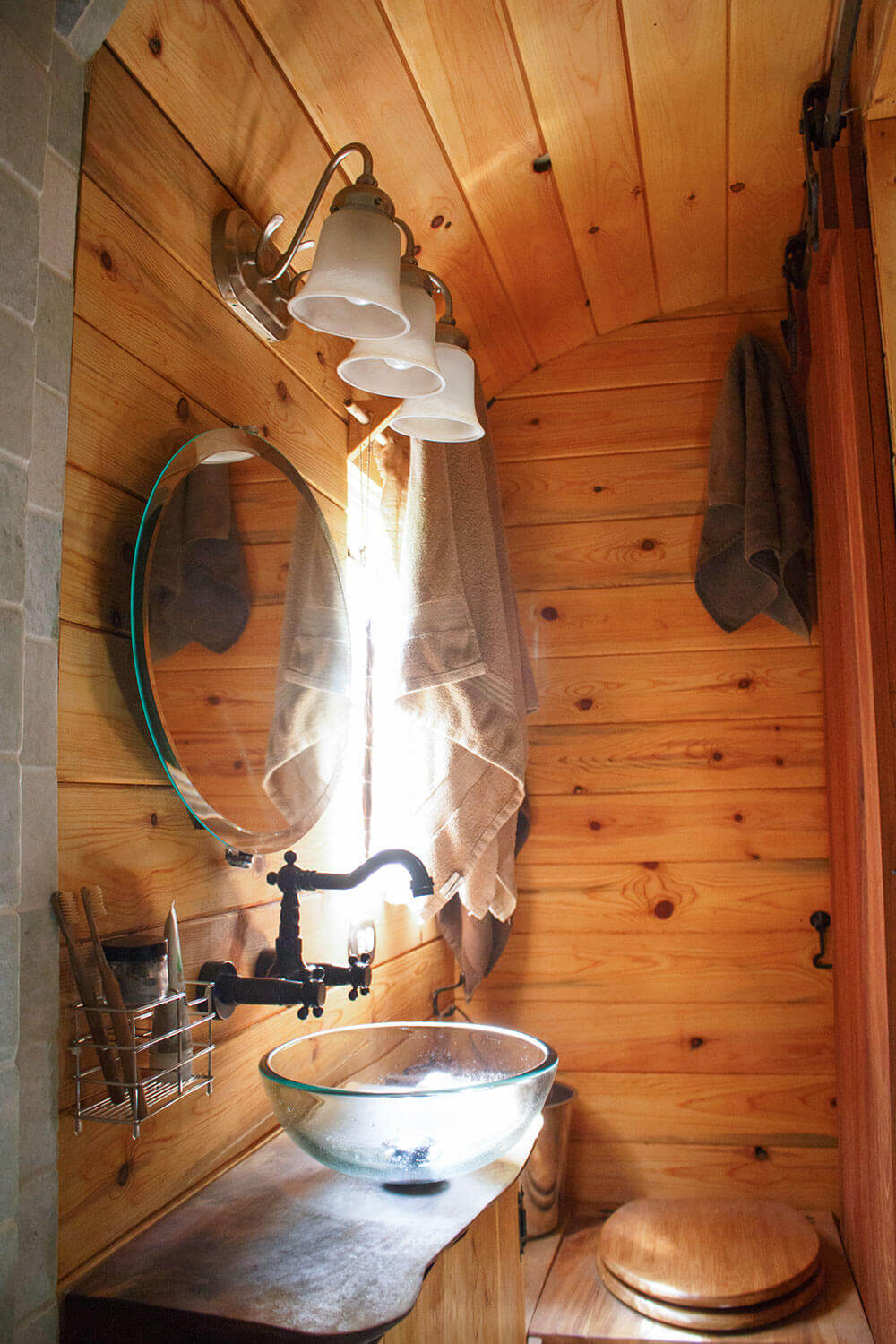 Who said a bathroom with a bucket toilet can’t be fancy?