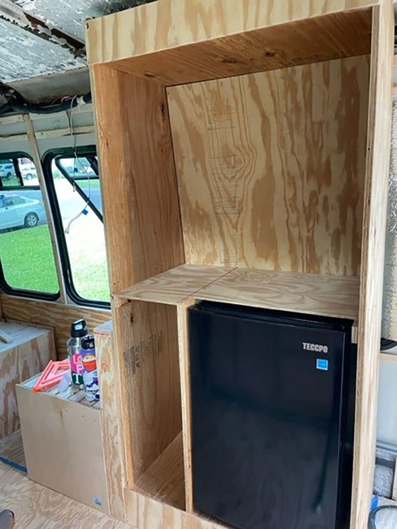 The frame of our closet. On top, we built a bar to hang our clothes. We put drawers on the bottom next to the fridge. We love the extra storage this brings us.