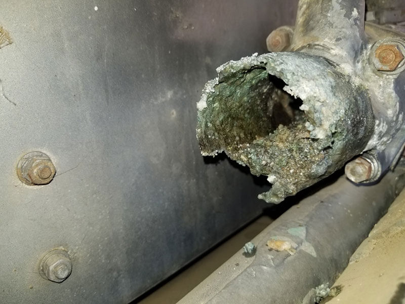 A kitty litter type of corrosion happened to the thermostat housing.