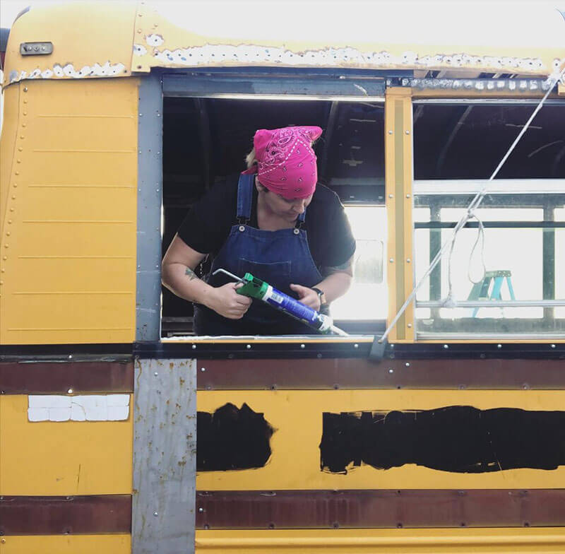 Resealing the back of the bus after removing and relocating the wheelchair lift (March 2020).
