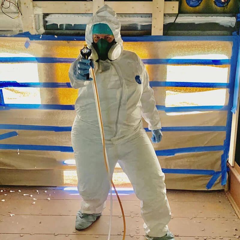 Spray foaming the ceiling and walls of the bus (May 2020).