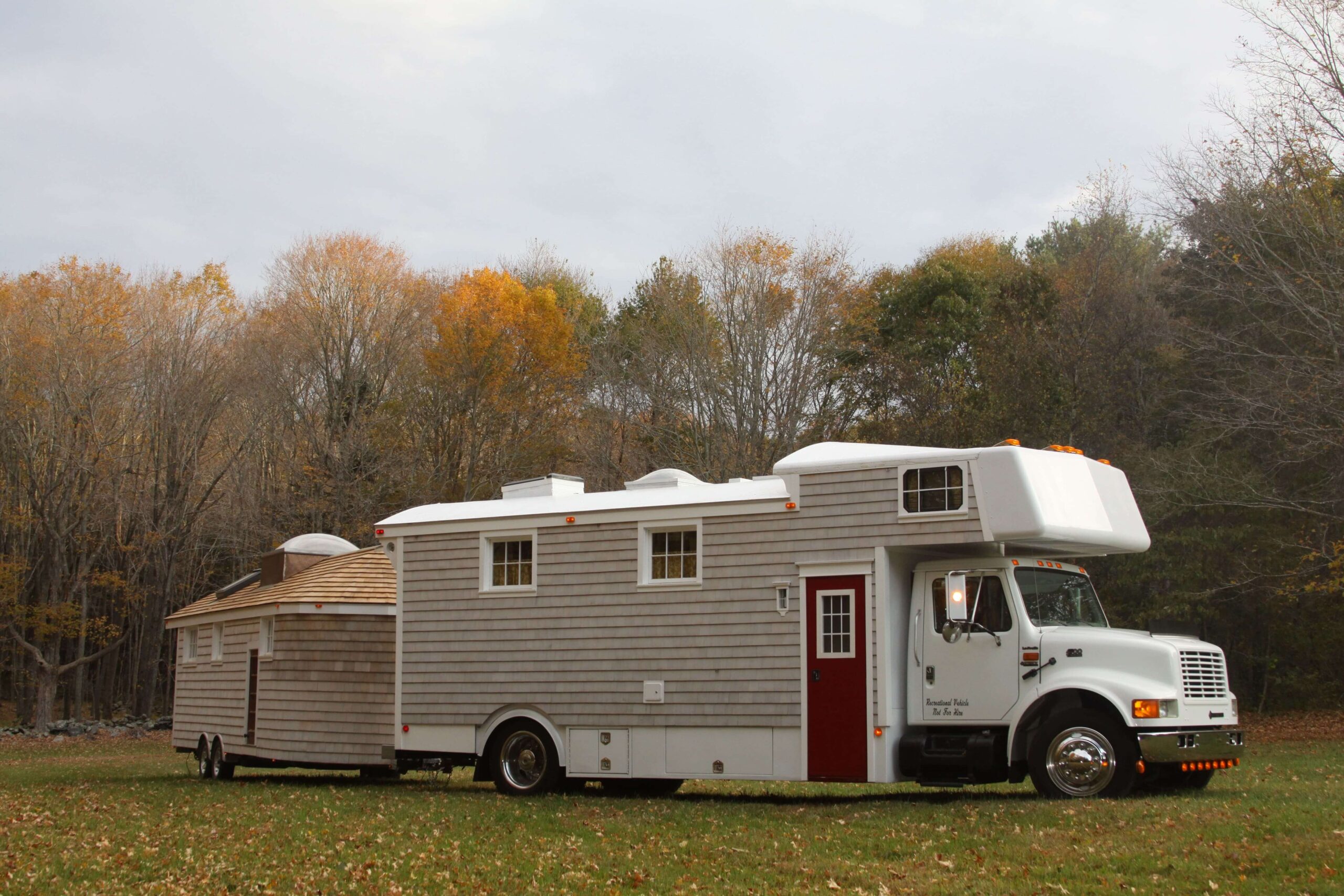Curbside view of completed toter-home and trailer.