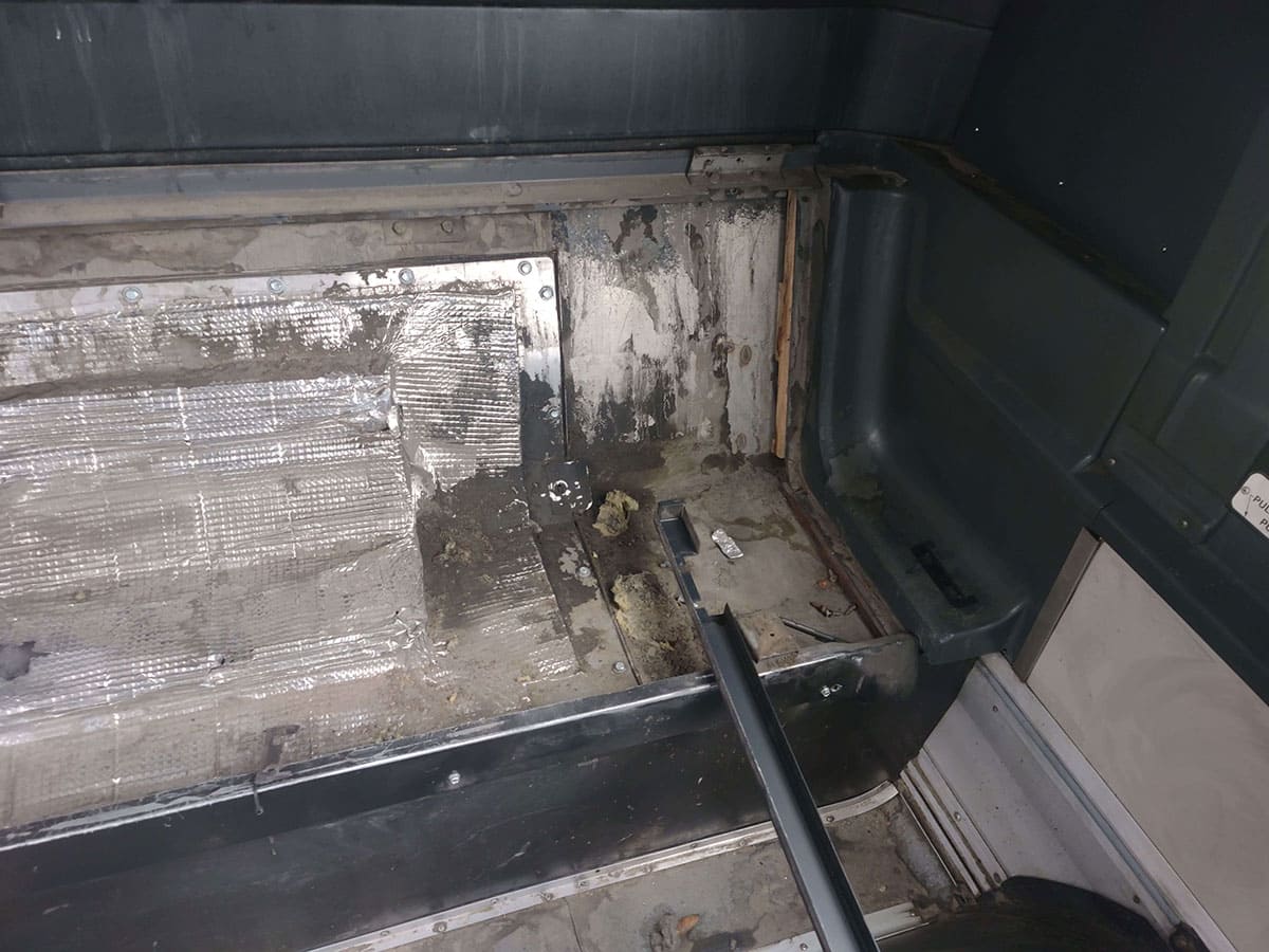 The engine access panel from the passenger compartment.