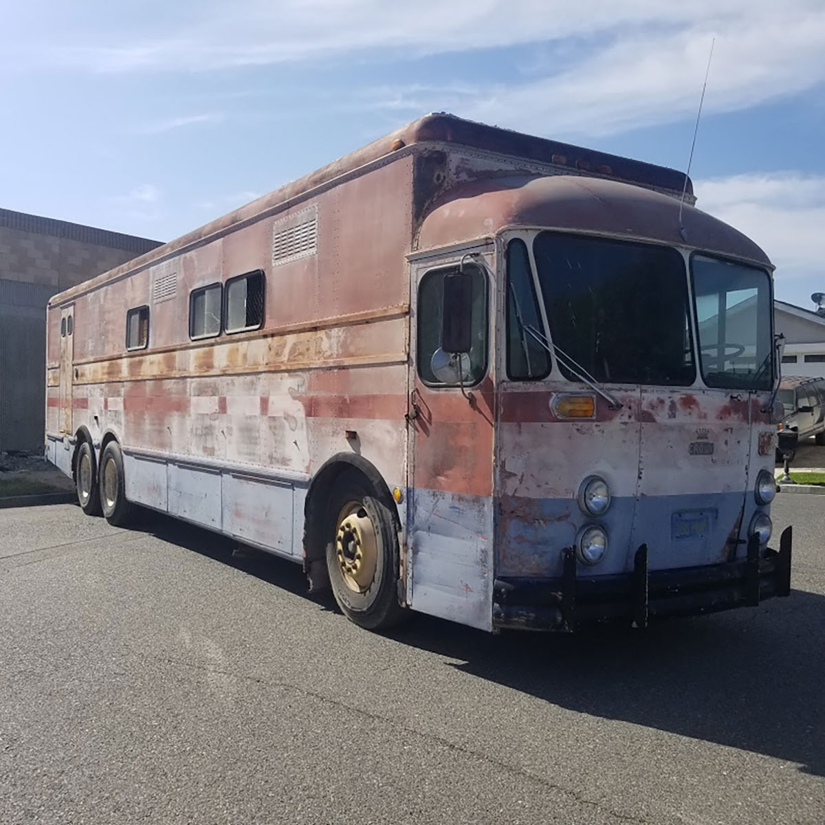 Highway Post Office Buses used in the early 1960s had very few windows as postal employees used to walk around inside sorting mail while traveling from one distribution center to the next and there were pigeonholes all along both walls for sorting mail.  This one recently sold in Southern California.