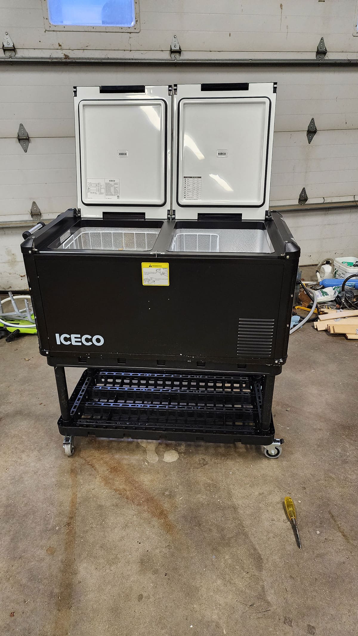Iceco refrigerator/freezer on rolling rack.