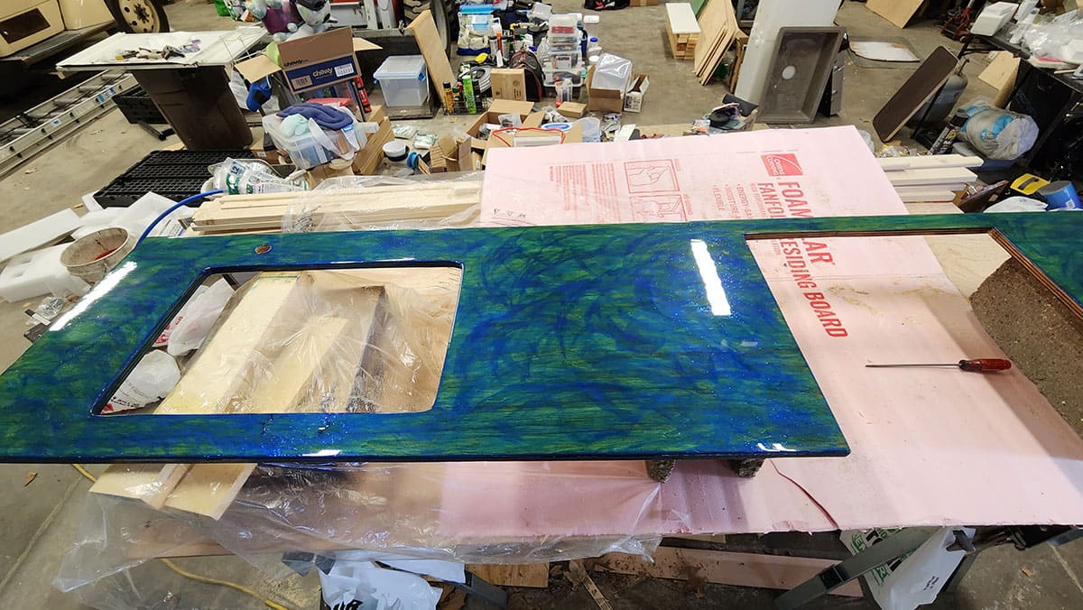 Countertop with blue craft paint and sealed with polyurethane.