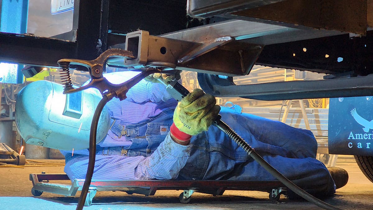 Welding up the custom-built tow hitch.