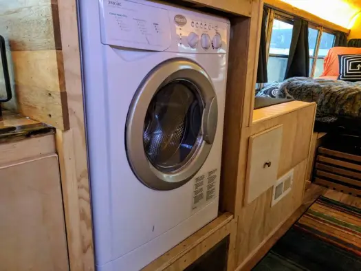 Washer/Dryer Combo. They are very convenient but require a lot of water for a bus.