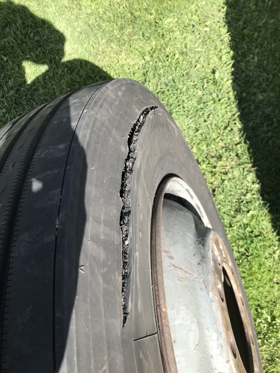 Exploding Bus Tire Totaled my Car - bus conversion photo
